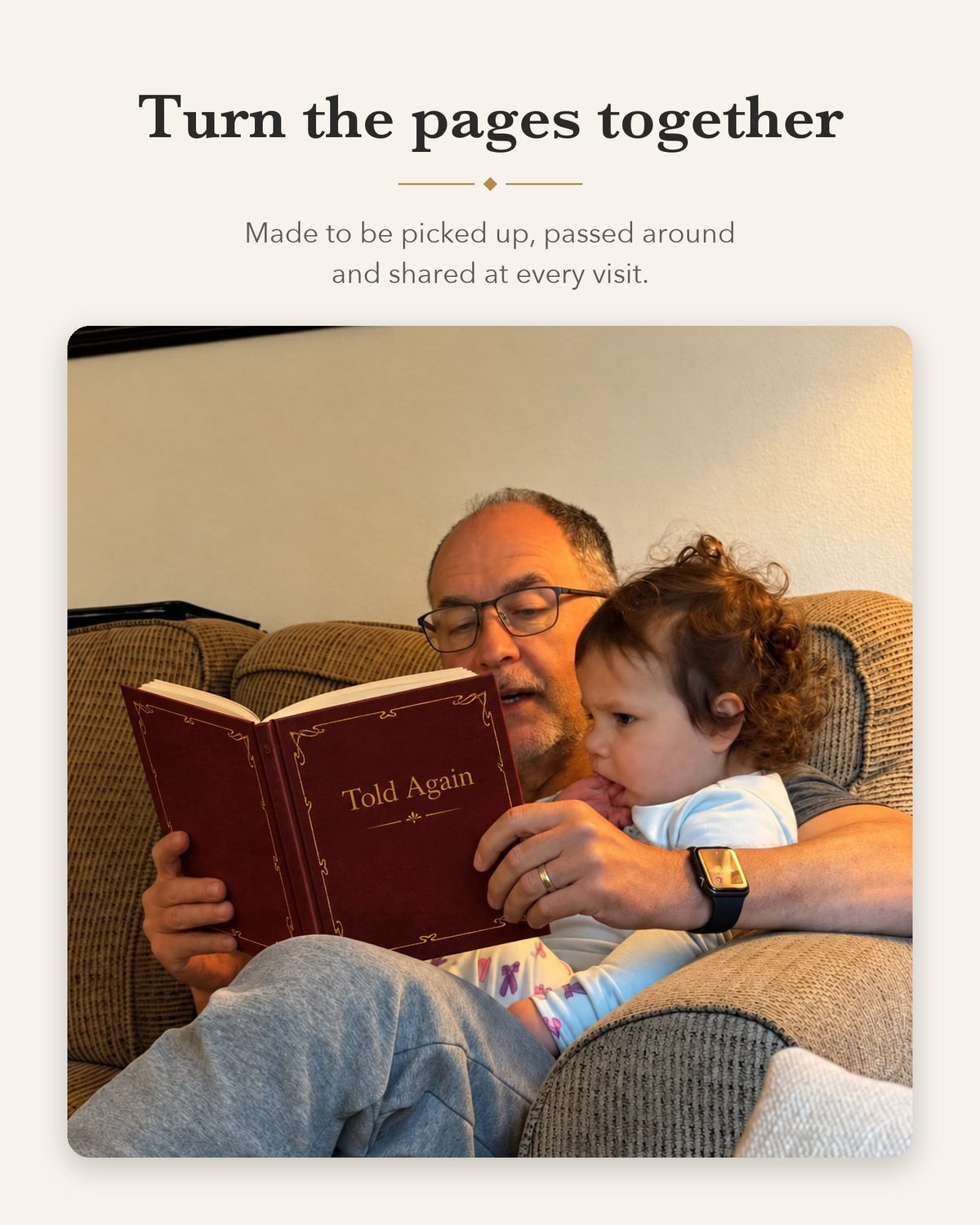 Grandfather reading the burgundy book with his granddaughter on the couch